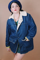 Men's or women's vintage 1970's Montgomery Ward label size medium long sleeve dark wash denim jacket with cream colored shearling liner.