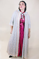 Women's vintage 1970's I. Magnin, Odette Barsa label long length short sleeve baby blue cream lace duster robe jacket with ribbon trim and peter pan collar.