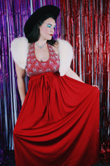 Women's vintage 1980's maxi length sleeveless red polyester halter wrap dress. Has silver sequins and beads on front chest.