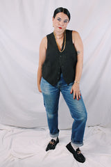 Men's or women's vintage 1970's sleeveless chocolate brown waistcoat vest in a wool and rayon mix material. Tortoise buttons and front pockets.