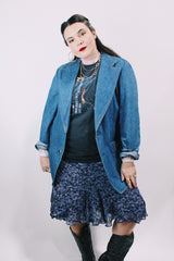 Men's or women's vintage 1970's Lee label long sleeve light wash denim blazer with two button closure, double lapel, and front pockets.