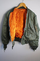 Men's or women's army zip up bomber jacket with long sleeves. Army green color with orange satin liner. Reversible.
