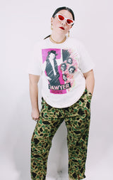 Women's or men's vintage 1990's Fruit of the Loom, Made in USA label short sleeve white Sawyer Brown band tee with multicolored graphic and text on front and back.