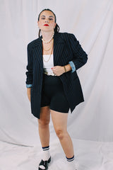 Men's or women's vintage 1970's University Seal Authentic Fashion label long sleeve navy blue wool blazer with all over pin stripes. Has pockets, textured buttons, and a back slit.