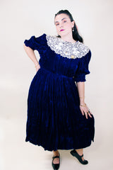 Women's vintage 1970's crushed blue velvet dress with cream embroidery peter pan collar. Short sleeves and ankle length.