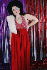 Women's vintage 1980's maxi length sleeveless red polyester halter wrap dress. Has silver sequins and beads on front chest.