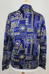 Men's or women's vintage 1970's Jantzen 100, Made in USA label long sleeve button up shirt in vibrant navy blue with all over orange, green, and white floral print.