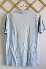 Women's or men's vintage 1980's Screen Stars, Made in USA label short sleeve baby blue tee with car racing graphic on the front from 1985.