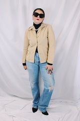 Women's vintage 1960's Union Made, Genuine Heeksuede Made in Holland label long sleeve short length tan colored suede button up lightweight jacket. Two front pockets and pink liner.