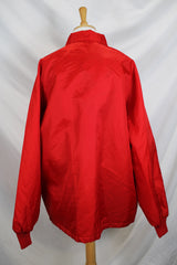 Men's or women's vintage 1980's Swingster, World of Wearables label long sleeve lightweight Nylon red windbreaker with popper buttons up the front, a patch, and furry fleece liner