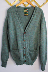 Women's or men's vintage 1970's Alps, Rugged Outdoors, Merrimac Valley, New England label long sleeve green colored button up cardigan.