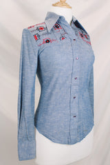 Women's vintage 1970's Western Trends by Panhandle Slim, Made in USA label long sleeve chambray denim top with black and white embroidery.