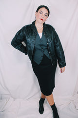 Women's vintage 1980's long sleeve black leather lightweight jacket. Dolman fit and snap buttons.