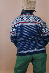 Women's or men's vintage 1970's Norway Handknitted label size large navy blue Norwegian style button up wool cardigan with all over white and red print