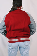 Men's or women's vintage 1980's DeLong, Made in USA label long sleeve dark red and grey varsity letterman jacket with patches and pins. Wool and leather material.