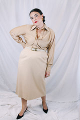 Women's or mens' vintage 1970's long sleeve button up shirt in a slinky nylon tan colored material. White buttons and dagger collar.