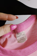 Women's vintage 1970's Chippie, Made in Bahamas label short sleeve bubblegum pink tee with a yellow and blue bee graphic on the front with a contrast trim.