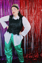 Women's vintage 1980's sleeveless beaded top with all over sequins and beads. Has scalloped edges on the hem and a zipper in the back.