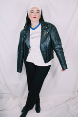 Men's or women's vintage 1970's Genuine Leather, Made in Mexico label long sleeve black leather moto leather jacket with silver hardware.