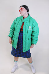 Men's or women's vintage 1980's King Louie Pro Fit, Made in USA label long sleeve kelly green puffer jacket with zipper and popper buttons up the front.