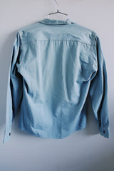 Men's or women's vintage 1970's Woodward's 7 Star Workwear label button up light blue chambray cotton shirt with two chest pockets.
