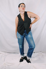 Men's or women's vintage 1970's sleeveless chocolate brown waistcoat vest in a wool and rayon mix material. Tortoise buttons and front pockets.