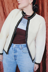 Women's vintage 1960's Brentwood Sportswear label long sleeve zip up cardigan in a waffle knit cream color. Has black and tan trim throughout.
