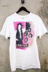 Women's or men's vintage 1990's Fruit of the Loom, Made in USA label short sleeve white Sawyer Brown band tee with multicolored graphic and text on front and back.