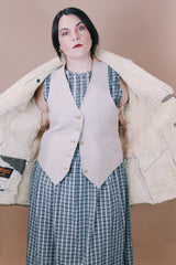 Men's or women's vintage 1970's Skinny's Hideout, Knight Tailors LTD. Australasia, Made in New Zealand label size large long sleeve tan brown suede medium length coat with cream shearling liner.