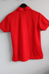 Women's vintage 1970's King Louie Creation, Made in USA label short sleeve red bowling top with half button closure, collar, and a pocket in polyester.