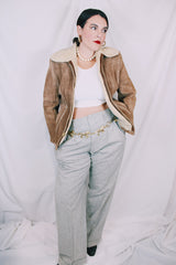 Men's or women's vintage 1970's light tan brown suede leather jacket with cream soft shearling liner. Zipper front closure and side pockets.