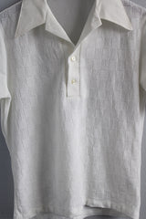 Men's or women's vintage 1970's Towncraft Designer Collection JCPenney label short sleeve white polo top with collar and half button closure in lightweight polyester.