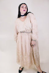 Women's vintage 1960's ankle length cream dress with lace overlay that has gold metallic detail. Beaded belt and beaded cuffs.
