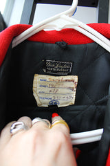 Men's or women's vintage 1960's Dick Longtin's Sports Huddle label long sleeve leather and wool zip up varsity letterman jacket in grey and red with pockets and nylon liner.