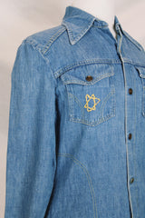 Women's vintage 1970's Montgomery Ward label long sleeve medium wash denim chambray top with snapper buttons.
