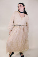 Women's vintage 1960's ankle length cream dress with lace overlay that has gold metallic detail. Beaded belt and beaded cuffs.