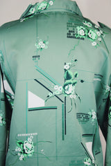Men's vintage 1970's Don Giovanni California label long sleeve green colored button up shirt with all over floral print in a thick polyester material.