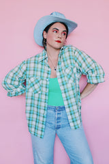 Men's or women's vintage 1970's JCPenney label long sleeve button up shirt in a white, green, and blue plaid print. Clear buttons, two chest pockets.