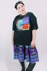 Women's or men's vintage 1996 Made in El Salvador label short sleeve black Steely Dan tour tee with multicolored graphic on front and back.