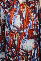 Men's vintage 1970's Joel label long sleeve button up shirt with all over red, blue, and navy abstract print in slinky polyester material.