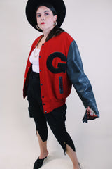 Men's or women's vintage 1970's De Long Sportswear Classics label long sleeve letterman bomber jacket with red wool body and black leather arms.