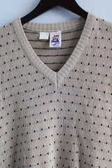 Men's or women's vintage 1970's Kennington California LTD. label sleeveless tan colored V shaped neckline sweater vest with dotted print all over in a soft acrylic material.