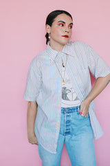 Men's or women's vintage 1970's Towncraft, Penneys label short sleeve white button up shirt with pink, yellow, and grey thin vertical stripes and one left chest pocket.