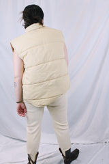 Women's or men's vintage 1970's A & M Industries, Seattle, Washington label sleeveless zip up puffer vest. Cream colored exterior, brown colored interior.