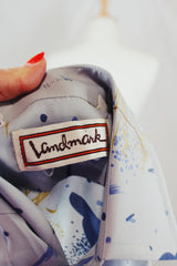 Men's vintage 1980's Landmark label long sleeve button up shirt in light baby blue with all over abstract prints.