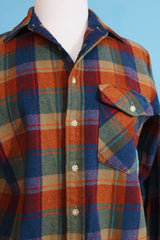 Men's or women's vintage 1970's Lobo, Pendleton label long sleeve button up shirt in a wool material in a tan, blue, and burn orange plaid print.