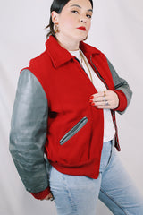 Men's or women's vintage 1960's Dick Longtin's Sports Huddle label long sleeve leather and wool zip up varsity letterman jacket in grey and red with pockets and nylon liner.