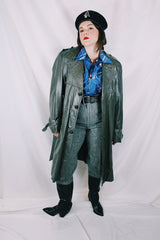 Men's or women's vintage 1970's Made in Argentina label knee length dark grey colored leather trench coat with double lapel and button closure.