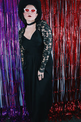 Women's vintage 1980's Made in USA label long sleeve ankle length black dress made with Polyester material.