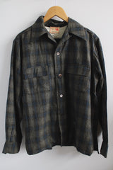 Men's vintage 1960's Hand Made by Alba Arnold label size large long sleeve button up shirt in blue and grey plaid in wool material. Has two chest pockets.